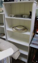 A white melamine shelf unit with five shelves