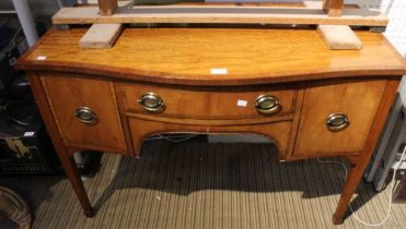 An early 20th century satinwood bow-fronted desk