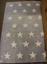 A modern slate grey star decorated rug