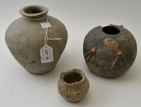 A Chinese ceramic vase, grey tinted, considered to be Neolithic, 16cm high, together with two other