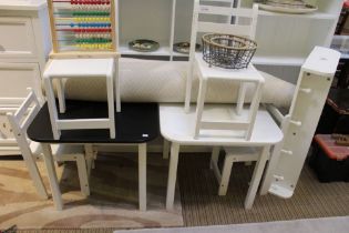 A set of nursery furniture to include two tables, four chairs, a foam mat and a wall