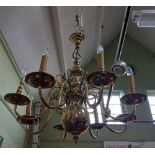 A large modern brass eight arm chandelier