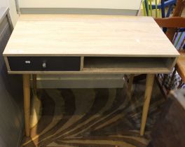 A modern grey finished computer desk, with storage compartments