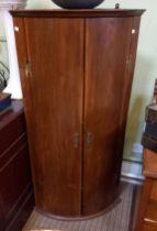 Large 20th century bow front corner cupboard