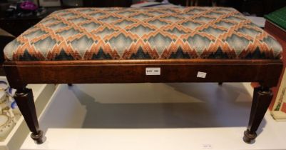 A tapestry topped stool