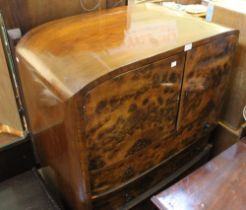 A possible 1930's walnut veneer dome topped drinks cabinet