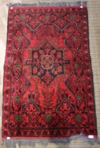 A red ground heath rug, geometric pattern, 123cm x 78cm