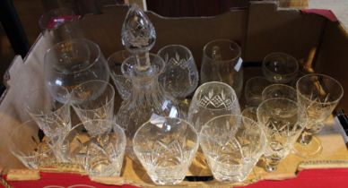 A box containing a cut glass decanter and drinking glasses