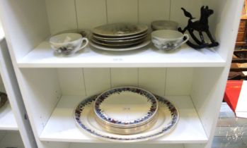 Two shelves of assorted tableware's & a metal miniature rocking horse