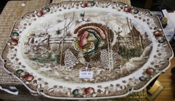 Large pottery serving platter decorated with a 'Christmas' turkey 52cm diameter