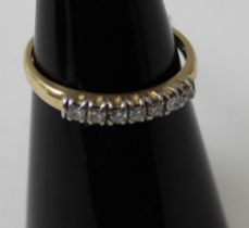 A 14k gold ring, inset seven small brilliant cut diamonds, gross weight 1.8g, ring size L1/2