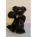 A large Charlie Bears Ebony teddy.