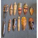 Twelve carved wood African tribal masks.