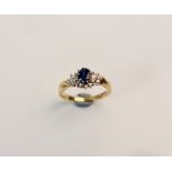 A hallmarked 9ct yellow gold sapphire and diamond cluster ring, ring size M,