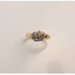 A stamped 9k diamond cluster ring, ring size O
