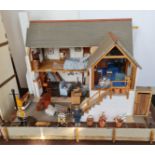 A hand made dolls house number 1 Quayside and holiday flat with furniture on two floors and front