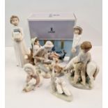 Four Lladro and five Nao figures.