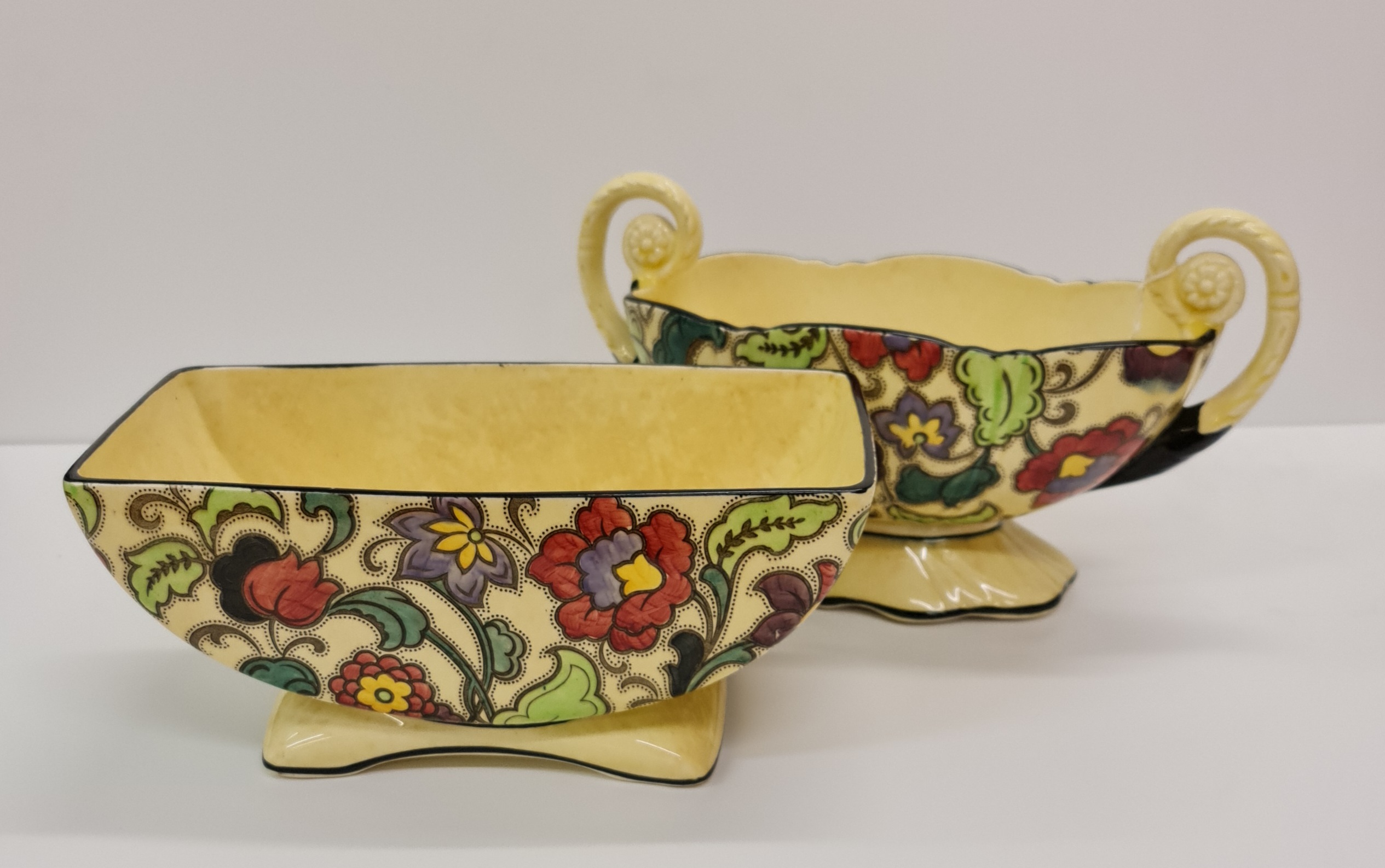 Two Tuscan Decorous pottery bowls one with handles hand painted flowers and leaf design.