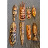 Eight carved wood African tribal masks
