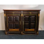 An arts and craft two door two drawer sideboard base with brass handles painted front and top.