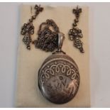 Hallmarked silver Victorian locket the front engraved bird on leaf design on rope twist chain,