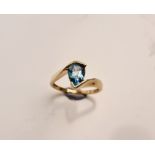 A stamped 9k blue topaz ring, ring size M