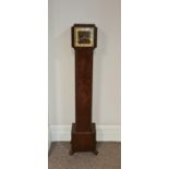 A walnut cased granddaughter clock height 142 1/2 cm.