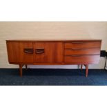 A teak Beautility sideboard base.