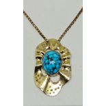 A turquoise pendant, set with an oval turquoise cabochon, measuring approx. 21x17mm, in an organic