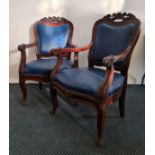 A pair of 19th century mahogany armchairs with carved shell back.