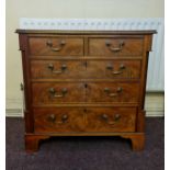 A small mahogany five drawer chest on bracket feet. Height approx 76 cm.