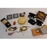 A collection of costume jewellery to include, brooches, pendant, cufflinks, powder compact, a 1965
