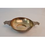 A hallmarked silver quaich with decorative handles, approx.diameter 12cms, approx. weight 161gms