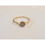 A hallmarked 9ct yellow gold diamond accents cluster ring, ring size P