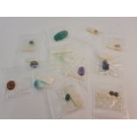 A collection of gem stones, mostly quartz.