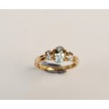 A hallmarked 9ct yellow gold aquamarine ring of three graduated stones, ring size M