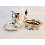 A collection of hallmarked silver to include, a salt shaker, ash tray, milk jug and champagne coater