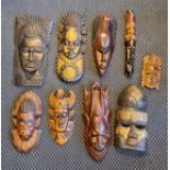 Eight carved wood African tribal masks.