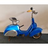 A Tri-ang blue pedal scooter .