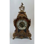 A French Empire boulle work style mantle clock will shell and leaf design brass height 57 cm.