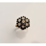 A hallmarked 9ct yellow gold sapphire and diamond cluster ring, ring size M1/2,