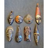 Eight carved wood African tribal masks.