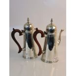 A hallmarked silver wooden handled coffee pot, approx. weight 670gms with a hallmarked silver wooden