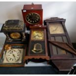 Five various wall clocks and a slate effect mantle clock.