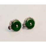 A pair of jadeite jade and diamond earrings each set with a circular piece of jadeite half