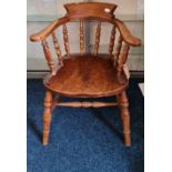 A 19th century captains chair and walnut loo table.