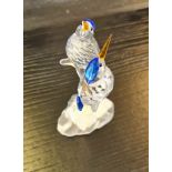 A Swarovski Crystal Kingfishers figure with blue and gold coloured parts.