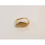 A pave set diamond cluster ring of wave design, assessed as 18ct gold, ring size M 1/2