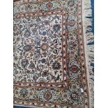 A Persian style beige floral rug.