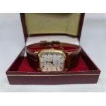 A gents gold plated Rotary quartz wrist watch, on brown strap, housed in Rotary box.